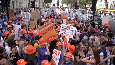 Hundreds-of-striking-Junior-Doctors-wearing-orange-hats-and-holding-placards-gather-for-a-rally-outside-Downing-Street
