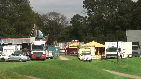 A-funfair-arrives-in-town-to-set-up-it's-rides,-stalls-and-entertainments-on-the-town-park