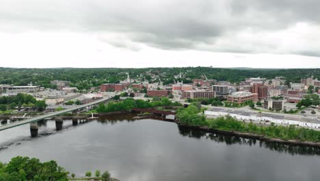 Drone-shot-pushing-over-the-Penobscot-River-to-reveal-Bangor,-Maine