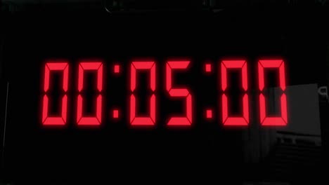 High-quality-CGI-render-of-a-digital-countdown-timer-on-a-wall-mounted-screen,-with-glowing-red-numbers,-counting-down-from-10-to-zero,-with-with-camera-slowly-pushing-in-dramatically