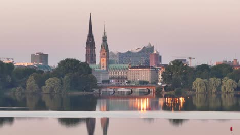 Skyline-of-Hamburg-during-golden-hour-sunrise,-cityhall,-Elbe-philharmonic-hall-,-establishing-shot