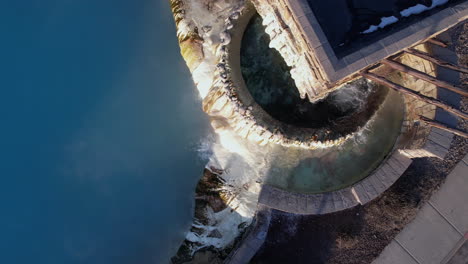 Top-Down-Aerial-View-of-Hot-Springs-Water-Flowing-Into-Pool-of-Spa-Resort-in-Colorado-USA,-High-Angle-Drone-Shot