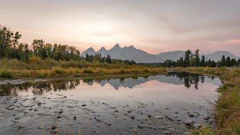 Reflection-Of-Clouds-And-Mountain-In-The-Snake-River-In-Schwabachers-Landing-During-Sunset