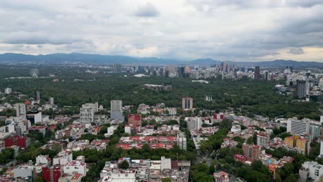Aerial-view-of-Chapultepec-Castle,-surrounded-by-forest-in-Mexico-City,-the-castle-is-unique-in-America-and-is-on-the-hill-of-Cerro-del-Chapulin