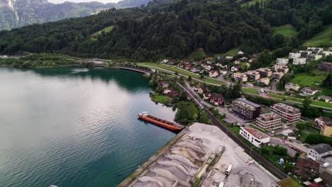 Train-on-Lake-Lucerne-Coastline-in-Horw-Town-in-Gorgeous-Swiss-Alps,-Aerial