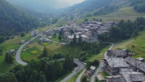 Aerial-dolly-forward-footage-of-the-village-near-Busca-in-Italy-below
