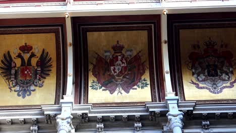 Close-up-of-Spanish-shield-painted-in-middle-of-Palacio-da-Bolsa,-Porto