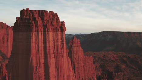 A-long-drone-shot-of-flying-through-the-grand-Fisher-Towers-in-Utah