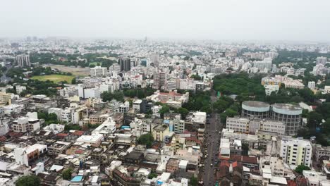 Aerial-panorama-view-of-Rajkot-city-showing-tall-high-rise-buildings-and-residential-old-buildings-on-the-other-side-of-the-city