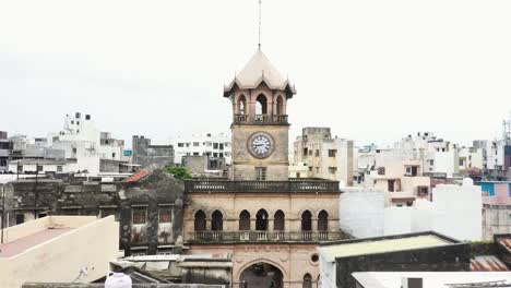 Aerial-drone-camera-moving-forward-showing-the-Raya-Naka-Tower,-the-main-gateway-to-Rajkot-City-during-the-British-era