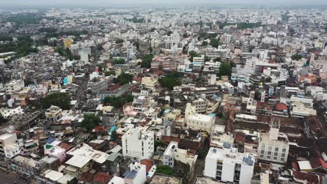 Aerial-drone-camera-coming-down-from-above-showing-entire-old-Rajkot-and-crowded-residential-houses