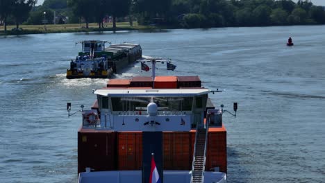 Cargo-ships-with-loads-of-colorful-iron-containers-transport-goods-down-the-river