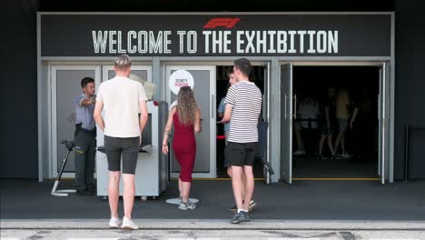 Visitors-go-through-a-security-check-at-the-entrance-of-the-world's-first-official-Formula-1-exhibition-at-IFEMA-Madrid