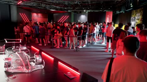 Visitors-queue-to-enter-the-world's-first-official-Formula-1-exhibition-at-IFEMA-in-Madrid,-Spain