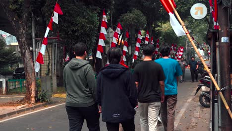 Indonesian-people-walking-on-the-streets-decorated-for-the-78th-Independence-Day-celebration