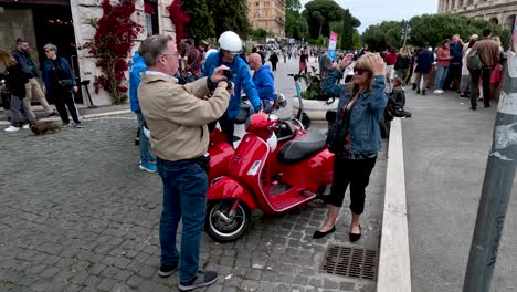 Tourists-Taking-Photos-Beside-Parked-Vespa's-With-Sidecar-On-Via-del-Colosseo-25