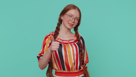 Redheaded-girl-raises-thumbs-up-agrees-or-gives-positive-reply-recommends-advertisement-likes-good