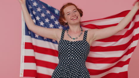 Young-woman-waving-and-wrapping-in-American-USA-flag,-celebrating,-human-rights-and-freedoms