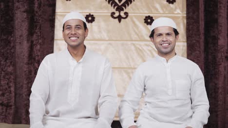 Two-muslim-men-looking-and-smiling-at-the-camera