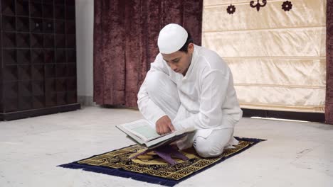 Indian-man-reading-Quran-at-home
