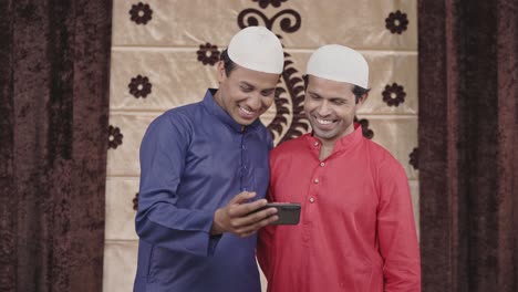 Two-muslim-men-watching-videos-on-youtube