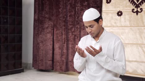 Indian-muslim-man-reading-Namaz-and-praying-to-Allah