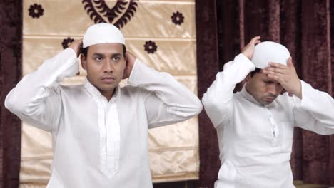 Muslim-men-adjusting-cap-and-getting-ready-for-Ramadan-prayer