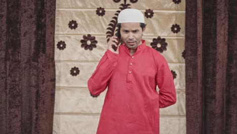 Happy-Muslim-man-talking-on-mobile-phone