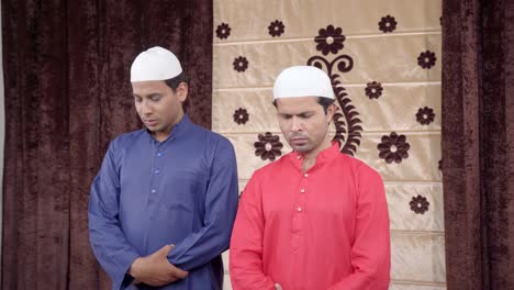 Two-muslim-men-showing-doing-Eid-prayer