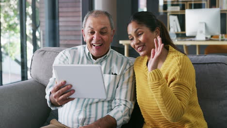 Father-and-daughter-using-a-digital-tablet
