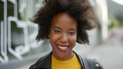 Face-of-an-edgy-young-woman-with-afro-smiling