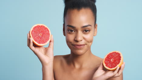 Vitamin-c,-grapefruit-and-skincare-woman-in-studio