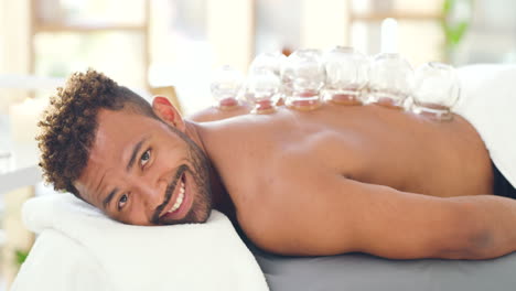 Man-at-spa-getting-a-cupping-massage-on-his-back