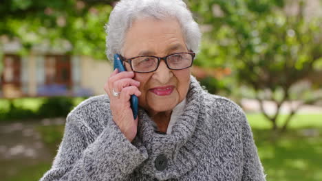 Phone-call,-retirement-and-senior-woman-at-park