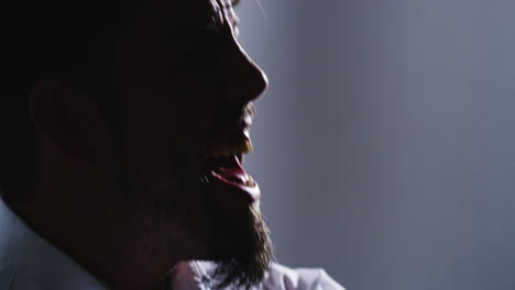 Closeup-silhouette-of-an-angry-man-screaming-alone