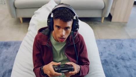Young-gamer-wearing-a-wireless-headset