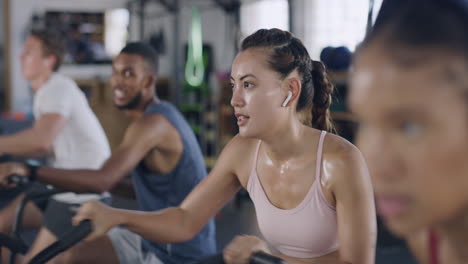 Focused-and-sporty-woman-during-a-spinning-class
