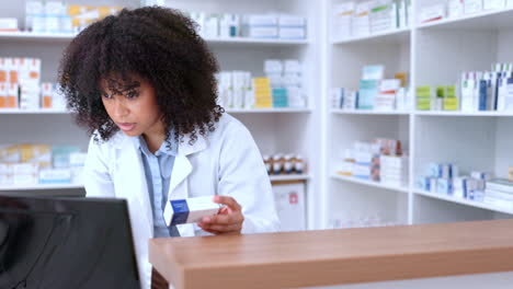 A-black-female-pharmacist-selling-medication