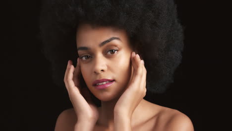 Beauty-portrait,-black-woman-touching-skincare