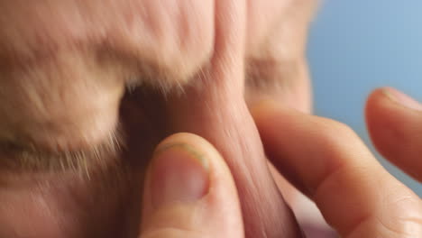 Sinus,-health-problem-and-senior-man-touching-face