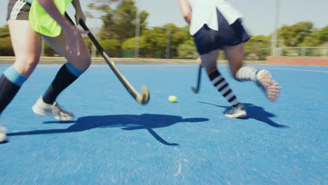 Closeup-of-hockey-player-using-stick-to-push-ball