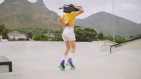 Female-roller-skater-with-a-boombox-dancing