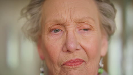 Elderly-woman-thinking,-real-sad-tired-blue-eyes
