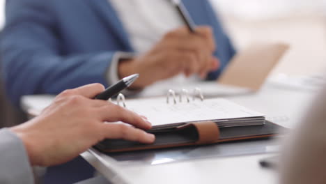 Business-woman,-hands-and-notebook-with-pen