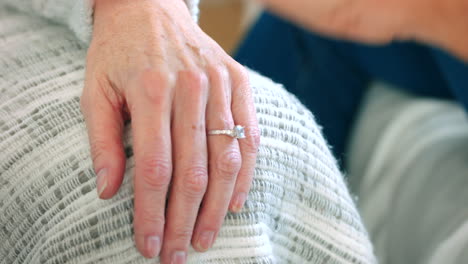 Commitment,-wedding-ring-and-support-with-hands
