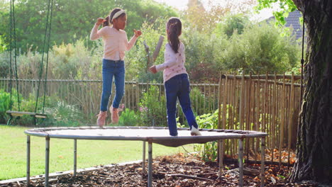 Happy-little-girls-jumping-on-a-trampoline