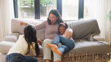 Happy-family-having-fun-on-a-sofa-at-home