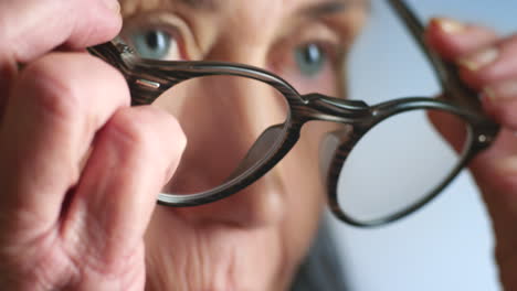 Glasses,-vision-zoom-and-senior-woman-reading