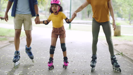 Family-with-cute-adopted-girl-learning-to-roller