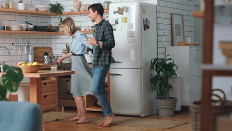 Love,-freedom-and-couple-dance-in-a-kitchen